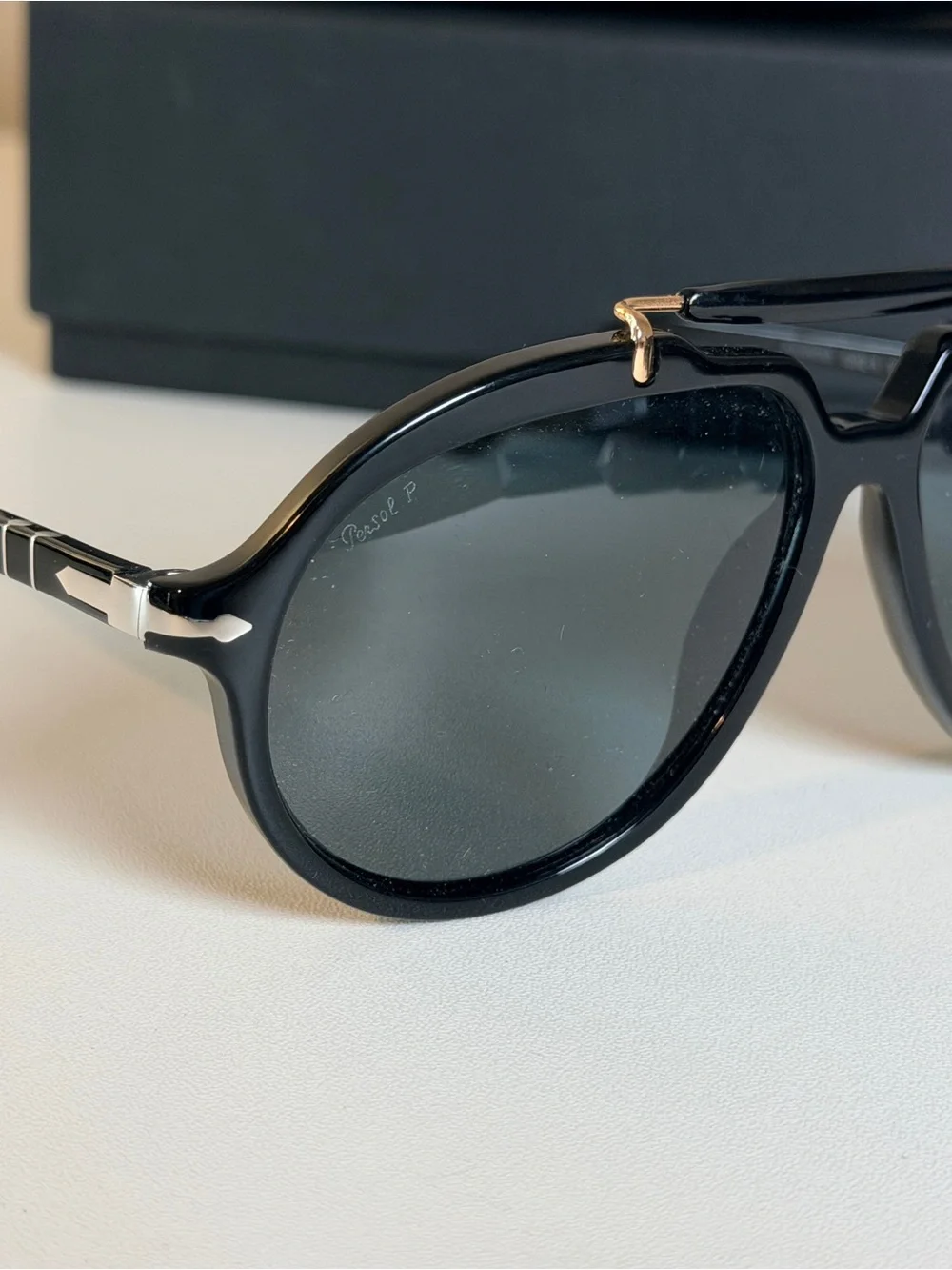 Persol Polarized Sienna Black Sunglasses with Gold Accents and Dark Lenses